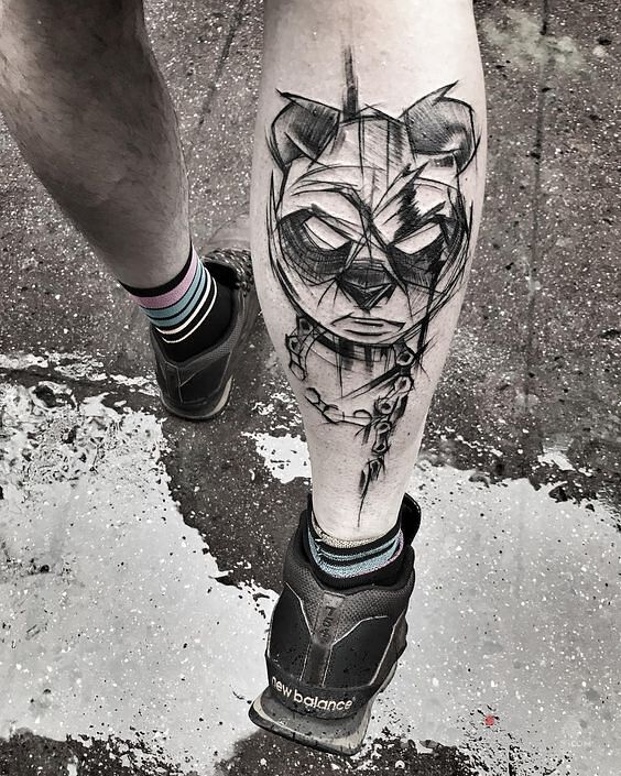 Tattoo Groźna panda in black and gray motif and sketch style on the calf