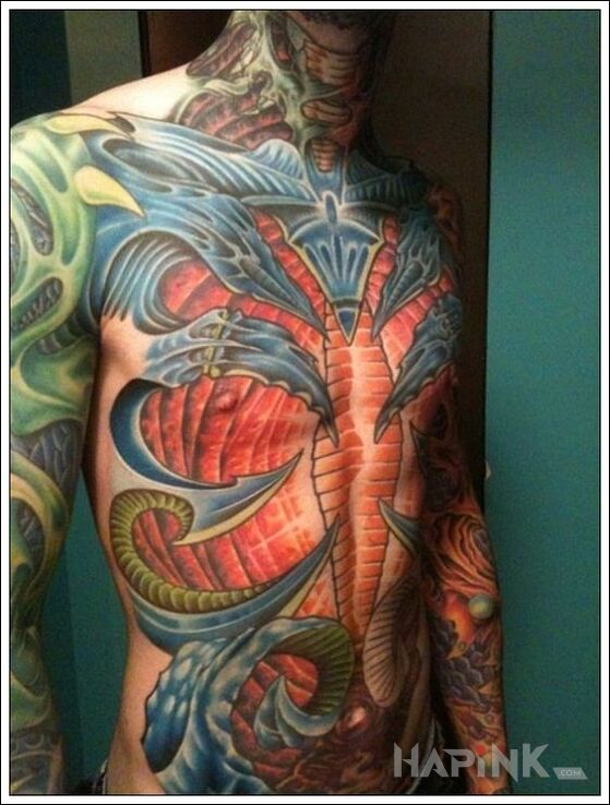 Tattoo Kolorowe dziwactwa in colorful motif and organic style on the ribs