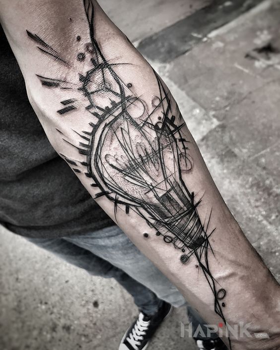 Tattoo Zarowka in objects motif and sketch style on the forearm
