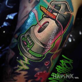 Tattoo Cap spray on the upper arm motif: objects style: graffiti