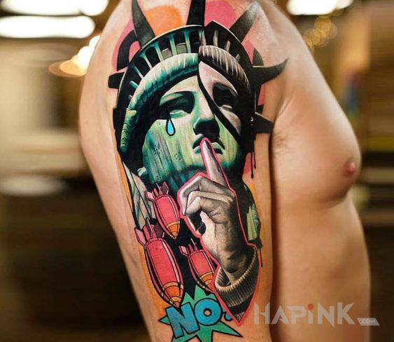 Tattoo Statua wolnosci in colorful motif and surrealistic style on the upper arm