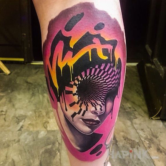Tattoo Czarna dziura in faces motif and surrealistic style on the calf