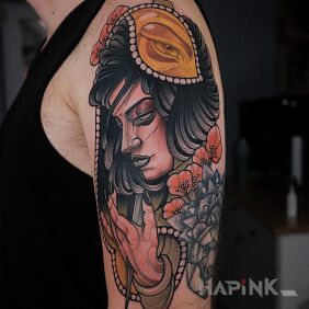 Tattoo Dagger in hand on the upper arm motif: colorful style: neo-traditional
