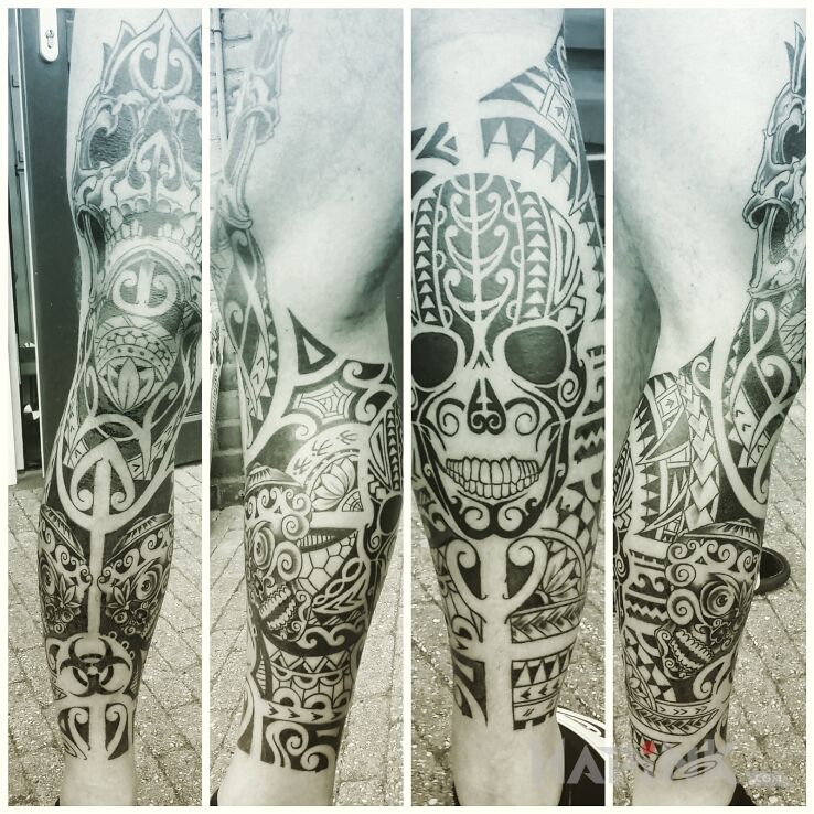 Tattoo Noga in legsleeves motif and Polynesian style on the tibia