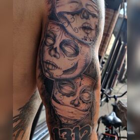 Tattoo Hand on the upper arm motif: black and gray style: graphic / illustrative