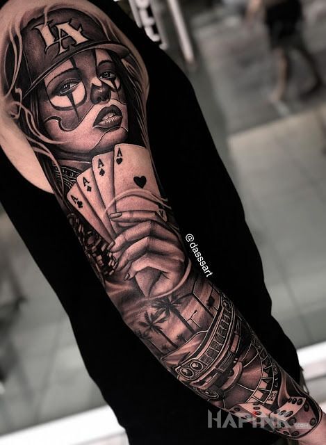Tattoo California casino in faces motif and realistic style on the upper arm