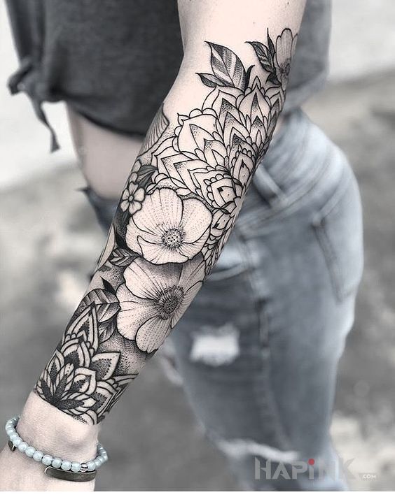 Tattoo Kwiaty + mandala in flowers motif and dotwork style on the forearm