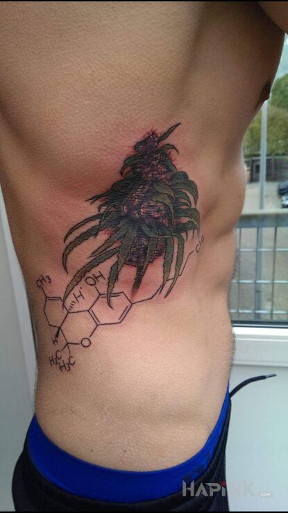 Tattoo THC in colorful motif and realistic style on the ribs