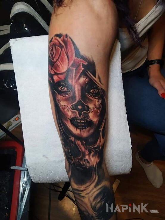 Tattoo La catrina in dark motif and realistic style on the upper arm