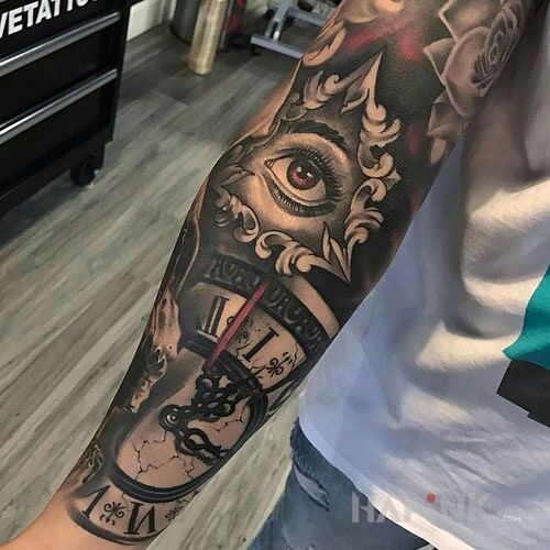Tattoo Fajny zegar in objects motif and realistic style on the forearm