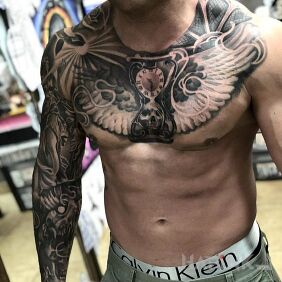 Tattoo Hourglass with wings on the collarbone motif: skulls style: realistic