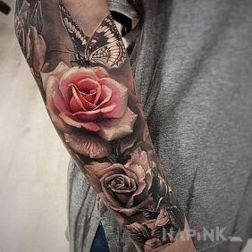 Tattoo A butterfly landing on a rose on the forearm motif: black and gray style: realistic
