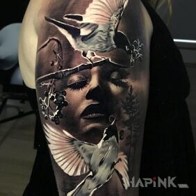 Tattoo Worried face on the upper arm motif: animals style: realistic