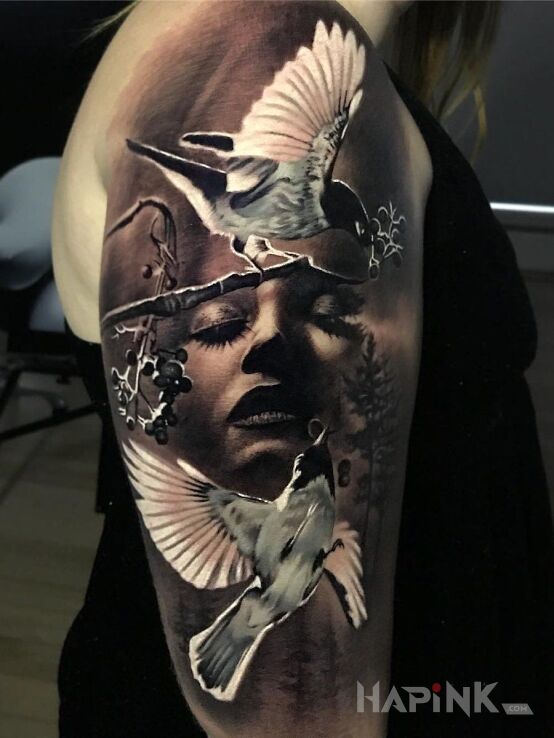 Tattoo Zmartwiona twarz in black and gray motif and realistic style on the upper arm