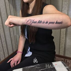 Tattoo Take your fate into your own hands on the forearm motif: lettering style: calligraphy