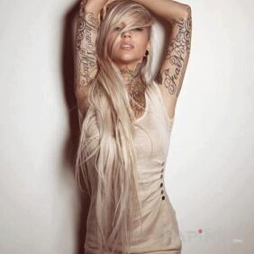 Tattoo Inscriptions on the arms on the leg motif: religious