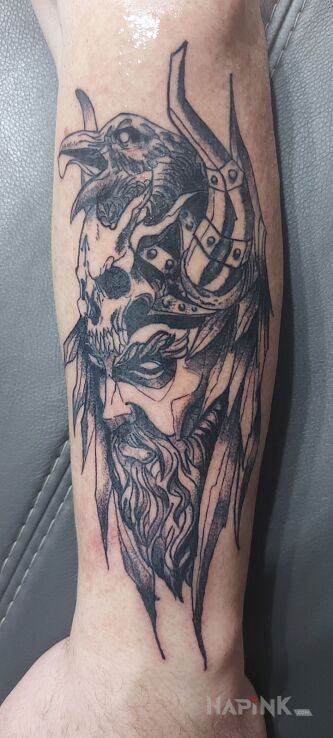 Tattoo Wiking in faces motif and Celtic / Nordic style on the forearm
