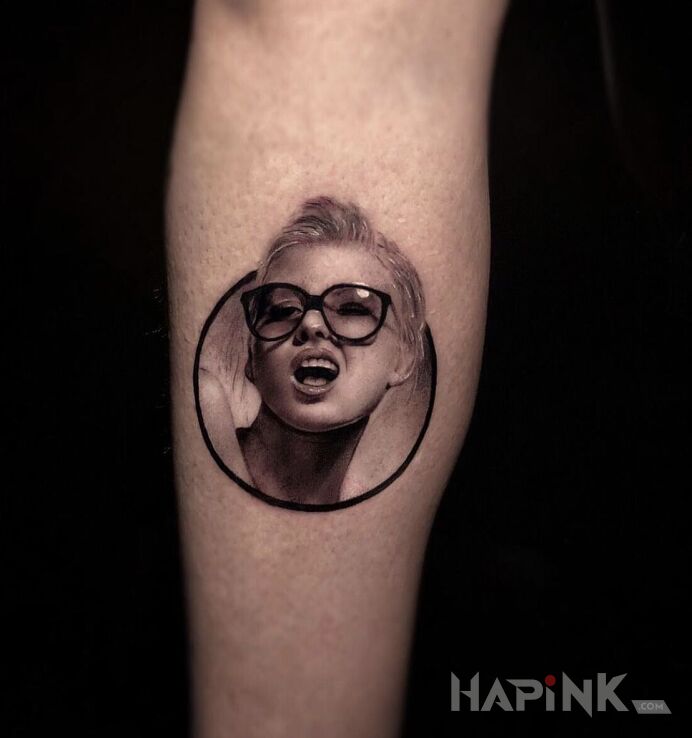 Tattoo Małe jest piękne in faces motif and realistic style on the forearm