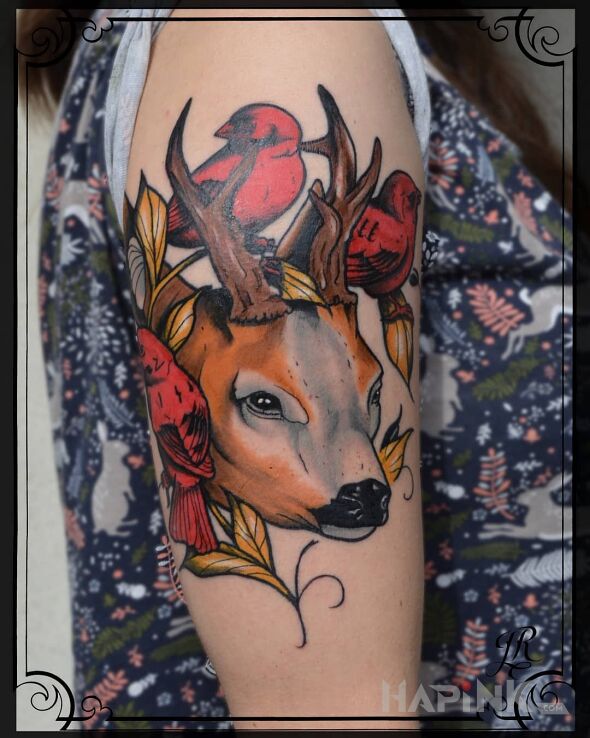 Tattoo Jelonek in flowers motif and neo-traditional style on the upper arm