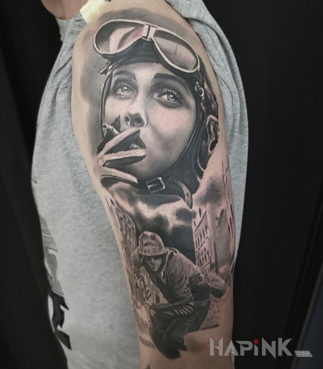 Tattoo Pilotka in war motif and realistic style on the upper arm