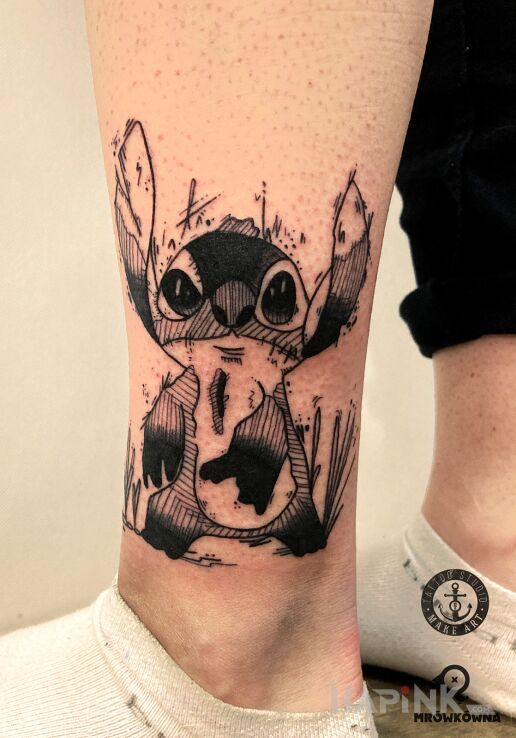 Tattoo Stich in characters motif and sketch style on the leg