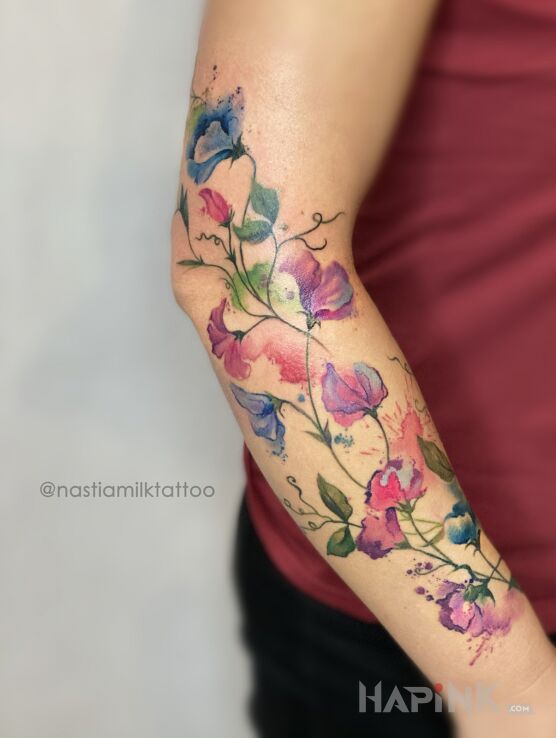 Tattoo Kwiaty kolorowe in colorful motif and Watercolor style on the forearm