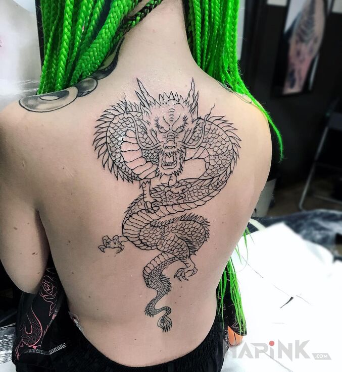 Tattoo Smok in dragons motif and graphic / illustrative style on the back