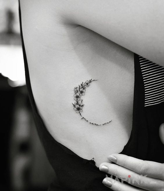 Tattoo Polksiezyc z kwiatow in lettering motif and graphic / illustrative style on the ribs