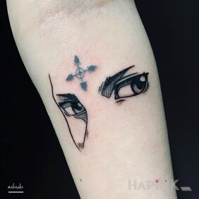 Tattoo Chrollo on the forearm motif: faces style: minimalistic