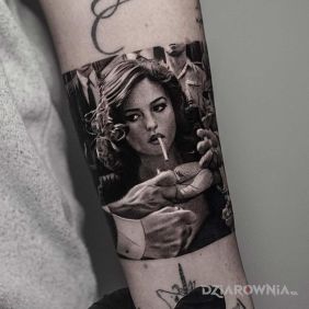 Tatuaż Monicca Bellucci na przedramieniu motyw: postacie styl: realistyczne