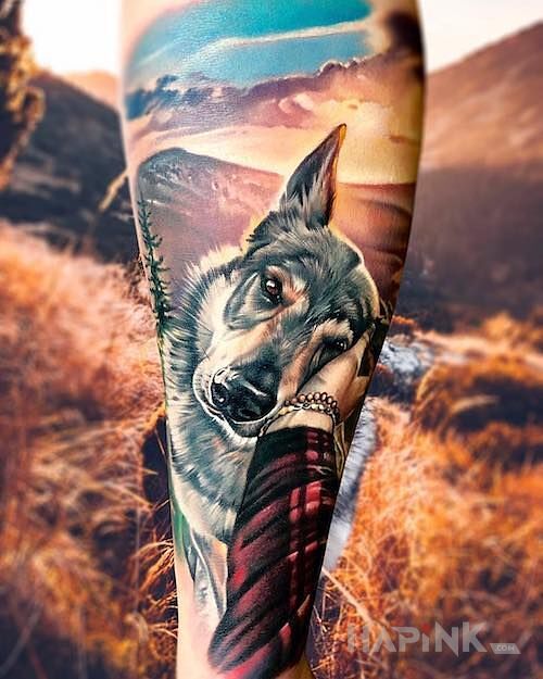 Tattoo Psiak in colorful motif and realistic style on the calf