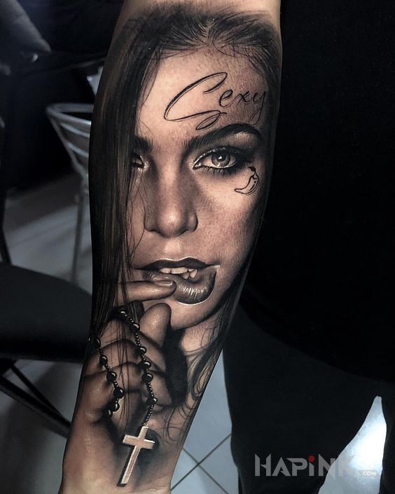 Tattoo Przegryziona warga in black and gray motif and realistic style on the forearm