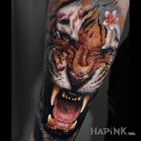 Tattoo Roaring tiger on the forearm motif: animals style: realistic