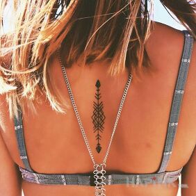Tattoo Arrow on the back motif: other style: minimalistic