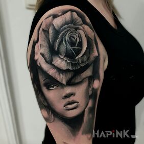Tattoo Woman flower on the upper arm motif: flowers style: realistic