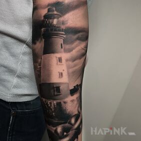 Tattoo Lighthouse on the forearm motif: black and gray style: realistic