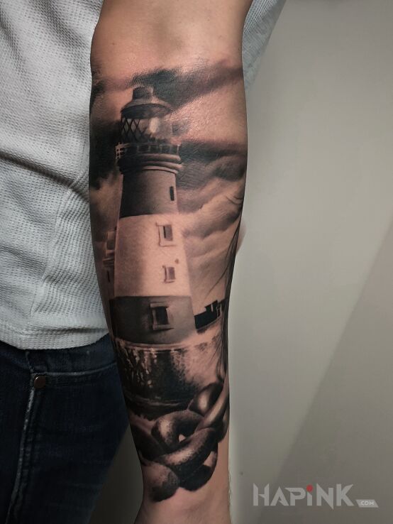 Tattoo Latarnia morska in other motif and realistic style on the forearm