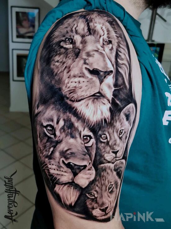 Tattoo Lwy in animals motif and realistic style on the upper arm