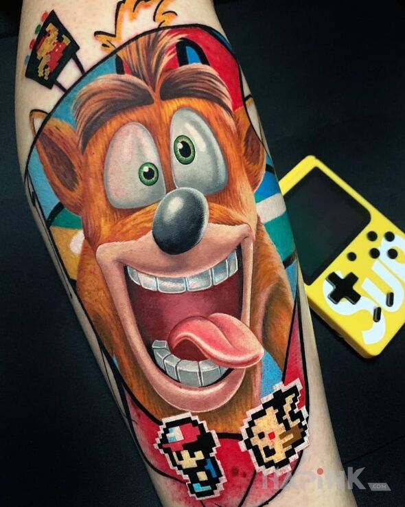 Tattoo Crash Banditcoot in colorful motif and cartoon / comic book style on the forearm