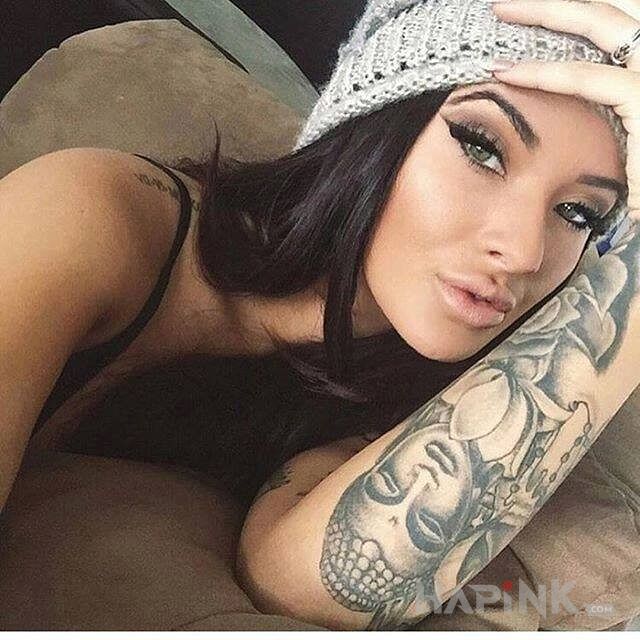 Tattoo Hinduski motyw in flowers motif on the forearm
