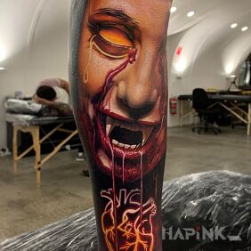 Tattoo Bloodied vampire on the forearm motif: faces style: realistic