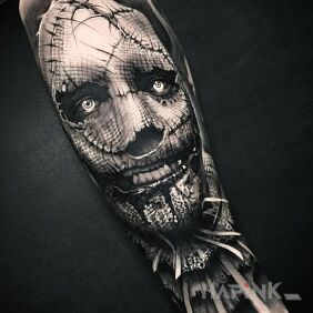 Tattoo Scarecrow on the forearm motif: dark style: realistic