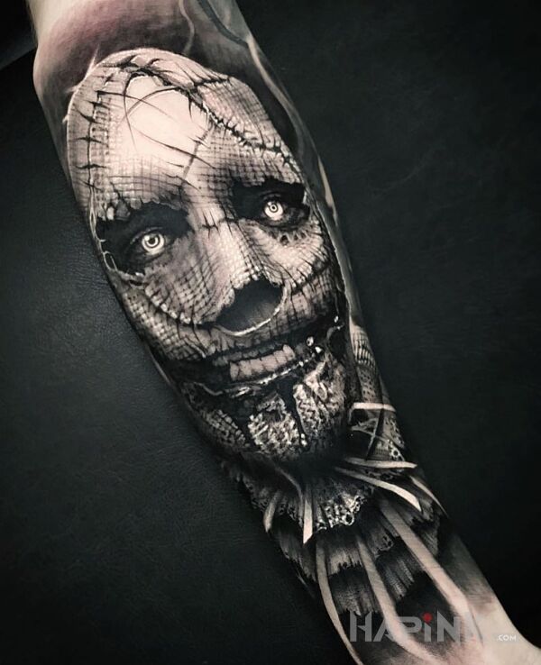 Tattoo Strach na wróble in black and gray motif and realistic style on the forearm