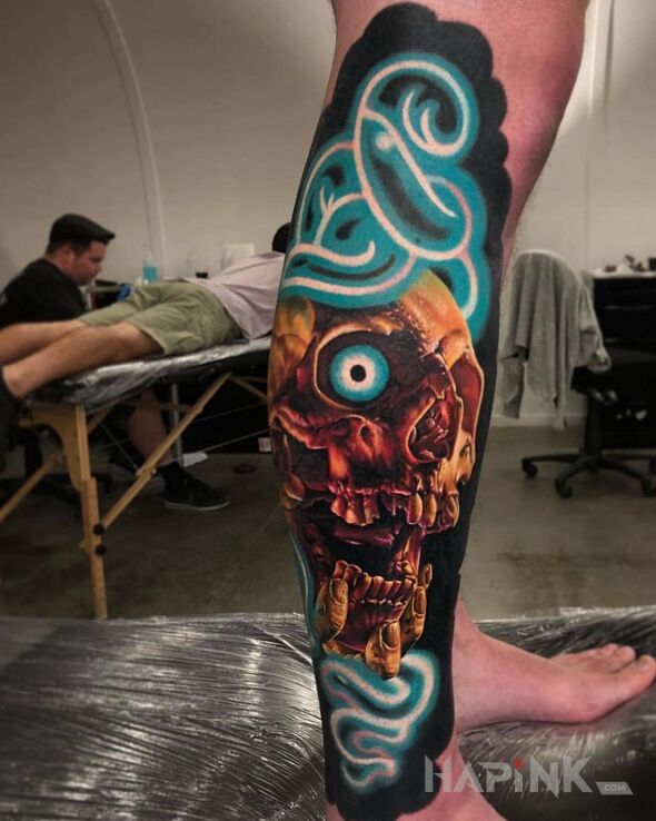 Tattoo Czachowe oko in colorful motif and realistic style on the calf
