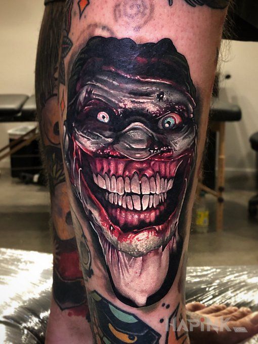 Tattoo Piękny uśmiech :) in demons motif and realistic style on the calf