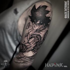 Tattoo Son goku on the upper arm motif: characters style: graphic / illustrative
