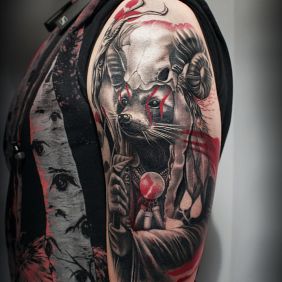 Tattoo Raccoon Shaman on the upper arm motif: skulls style: trash polka