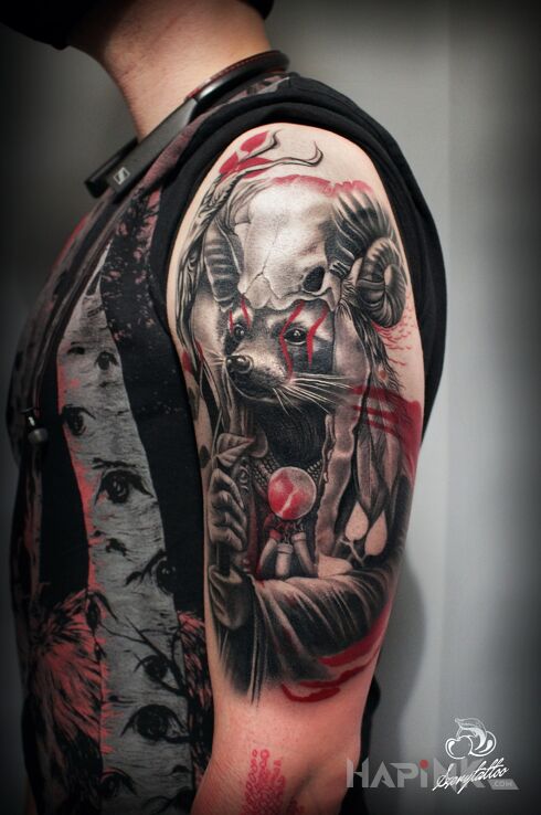 Tattoo Szop Szaman in skulls motif and realistic style on the upper arm