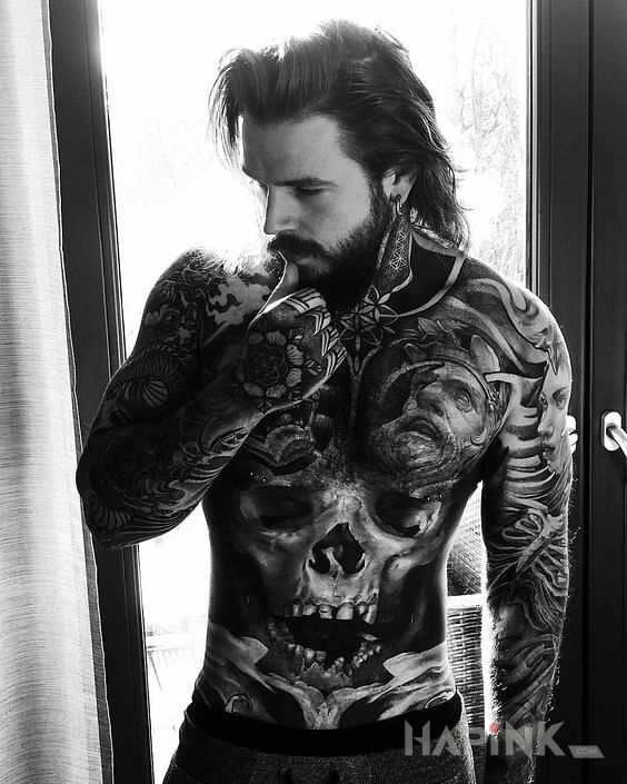 Tattoo Brzuchoczaszka ? in black and gray motif and graphic / illustrative style on the hand