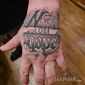Tattoo And another one flew in ? on the hand motif: lettering style: calligraphy